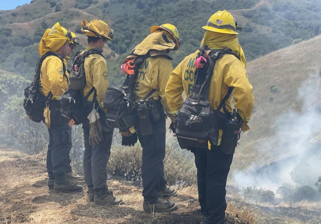 Marin Fire Department new recruits taking a break after facilitating a controlled burn.