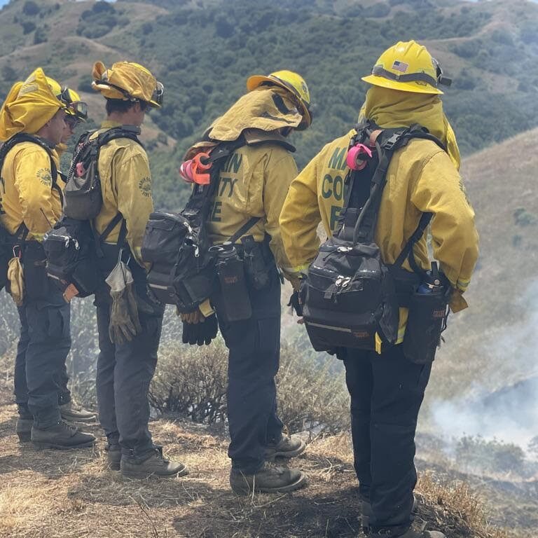 Marin Fire Department new recruits taking a break after facilitating a controlled burn.