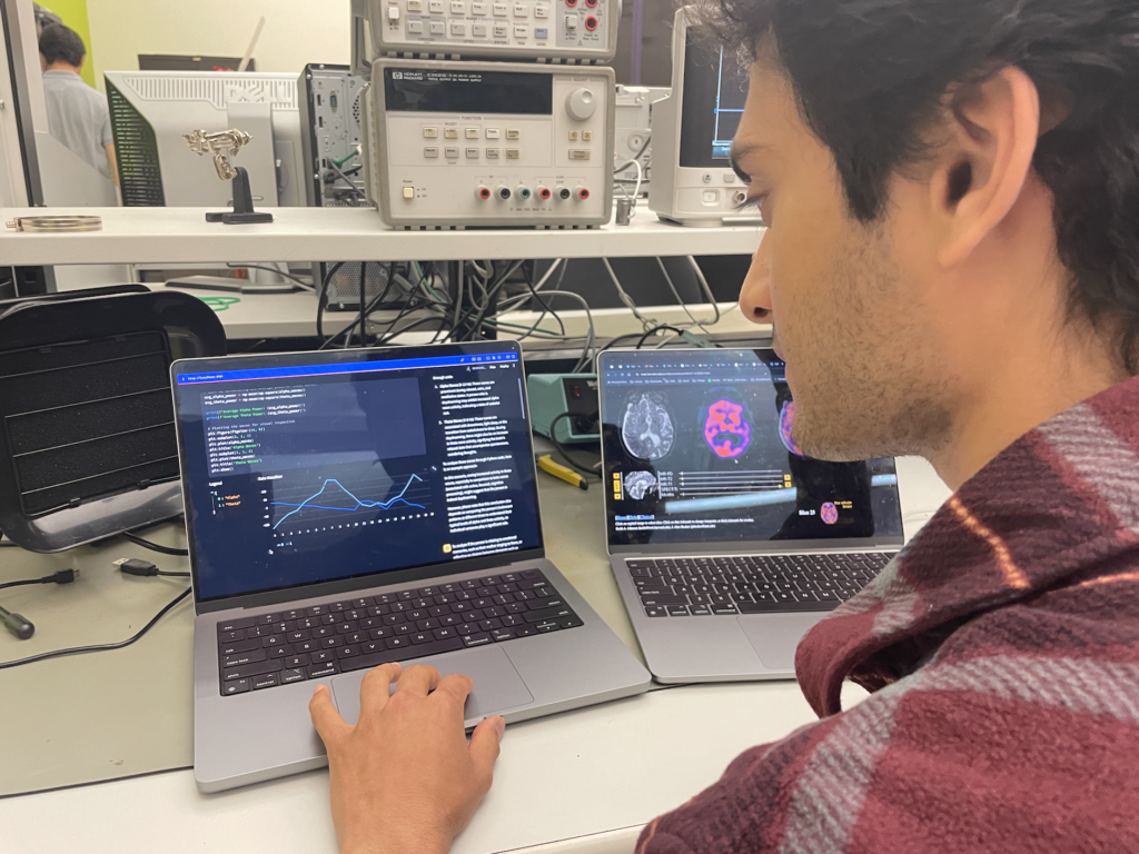 UC Berkeley student sits in front of a computer and uses SimpleCell in a lab. 